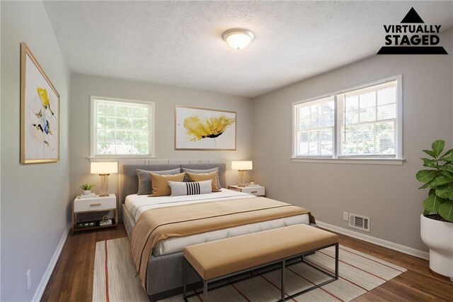 802 San Miguel Dr, Stone Mountain, GA 30083 - bedroom featuring baseboards, wood finished floors, and a textured ceiling