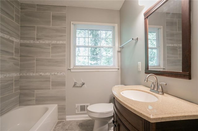 802 San Miguel Dr, Stone Mountain, GA 30083 - full bathroom featuring toilet, vanity, baseboards, tile patterned flooring, and shower / bathtub combination