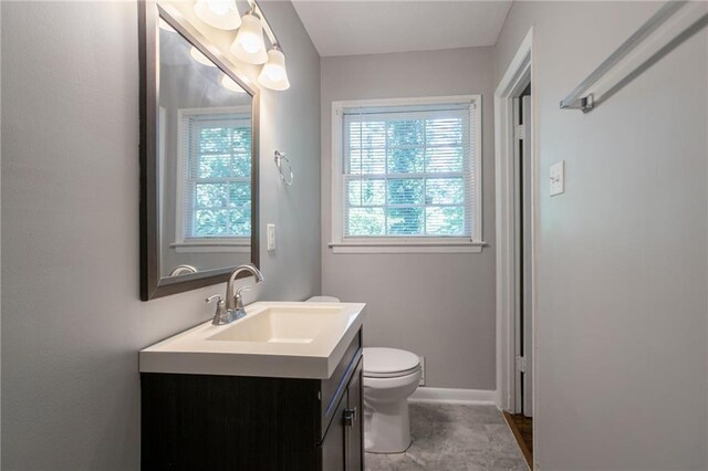 802 San Miguel Dr, Stone Mountain, GA 30083 - bathroom with vanity, toilet, and baseboards