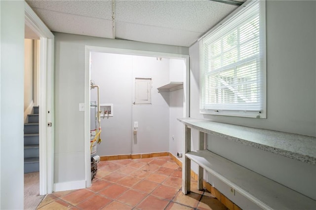 802 San Miguel Dr, Stone Mountain, GA 30083 - washroom with baseboards, light tile patterned floors, and electric panel