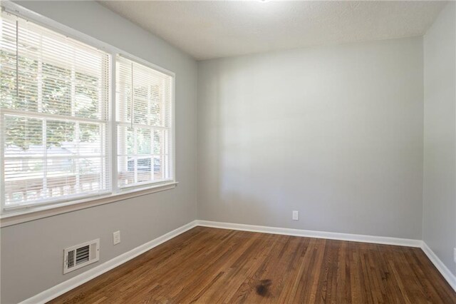802 San Miguel Dr, Stone Mountain, GA 30083 - unfurnished room featuring baseboards and dark wood finished floors
