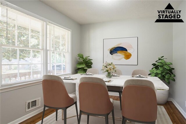 802 San Miguel Dr, Stone Mountain, GA 30083 - dining space featuring wood finished floors and baseboards