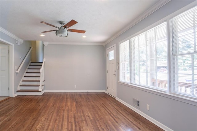 802 San Miguel Dr, Stone Mountain, GA 30083 - unfurnished living room with healthy amount of natural light, ceiling fan, stairs, ornamental molding, and wood finished floors