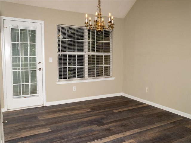 unfurnished dining area featuring lofted ceiling, dark wood-style flooring, and baseboards