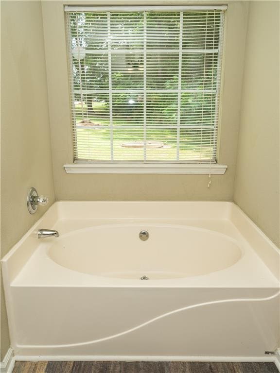 bathroom with a garden tub