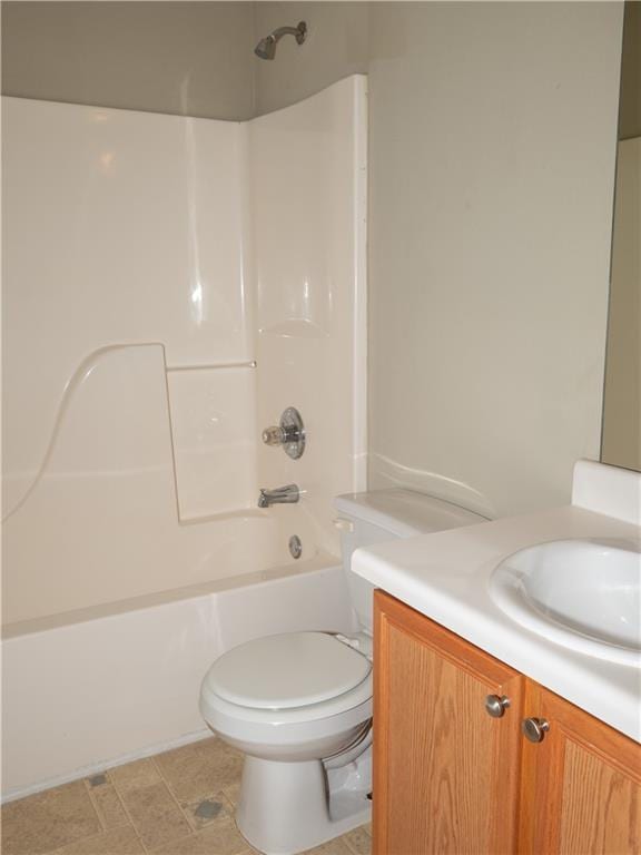 full bath featuring bathtub / shower combination, vanity, and toilet