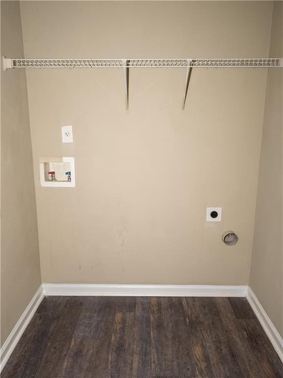 clothes washing area with laundry area, washer hookup, electric dryer hookup, and baseboards