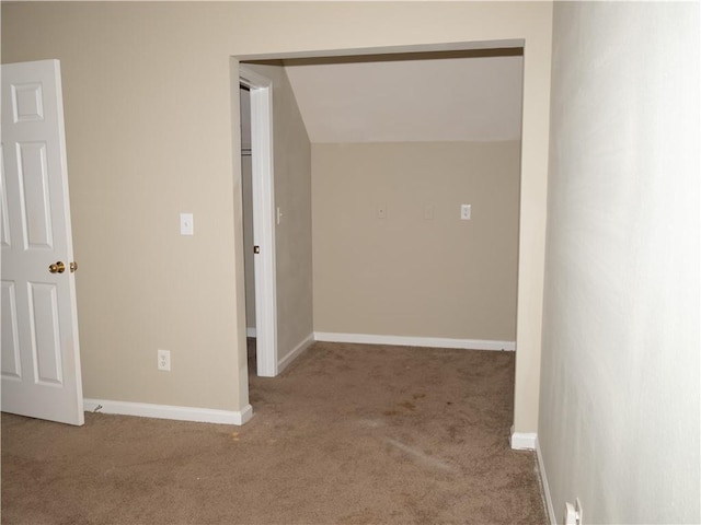 corridor featuring carpet and baseboards