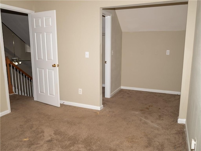 unfurnished bedroom with carpet and baseboards