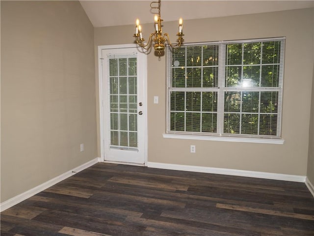 interior space featuring dark wood-type flooring, a wealth of natural light, and baseboards