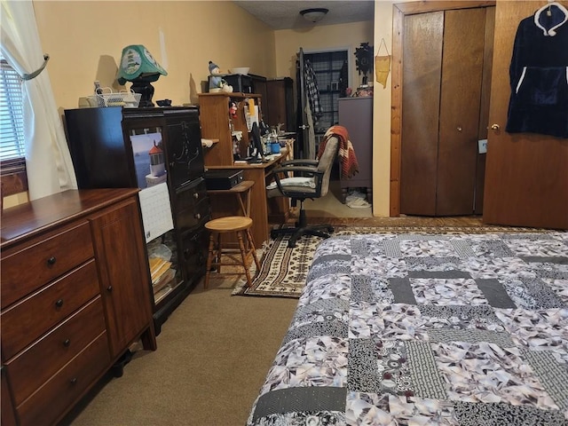 bedroom with light carpet and a closet