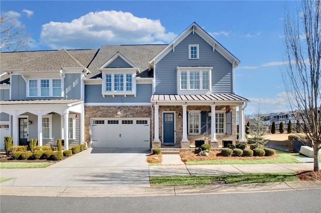 view of front of property with a garage and covered porch