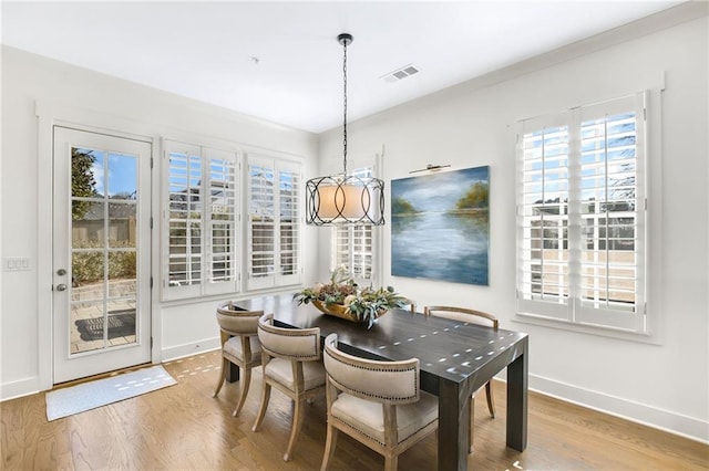 dining space featuring hardwood / wood-style flooring