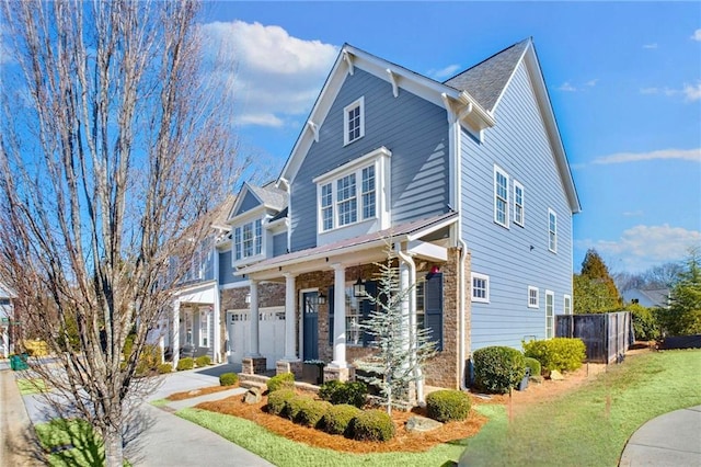 view of front of home featuring a garage and a front yard