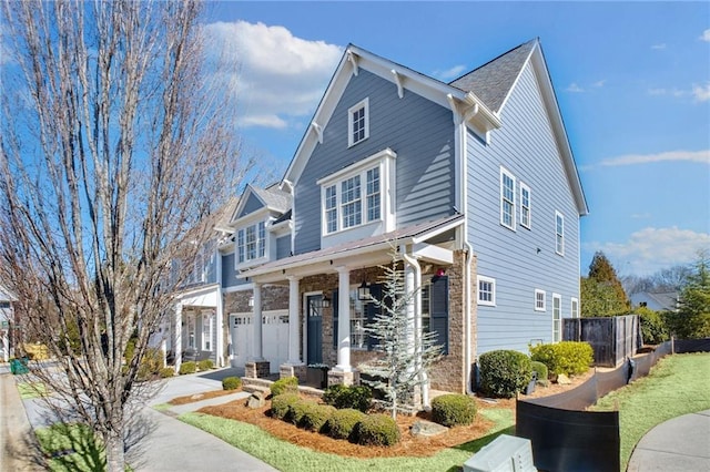 view of front of house featuring a garage and a front lawn