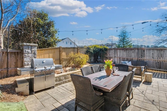 view of patio / terrace featuring an outdoor hangout area and grilling area