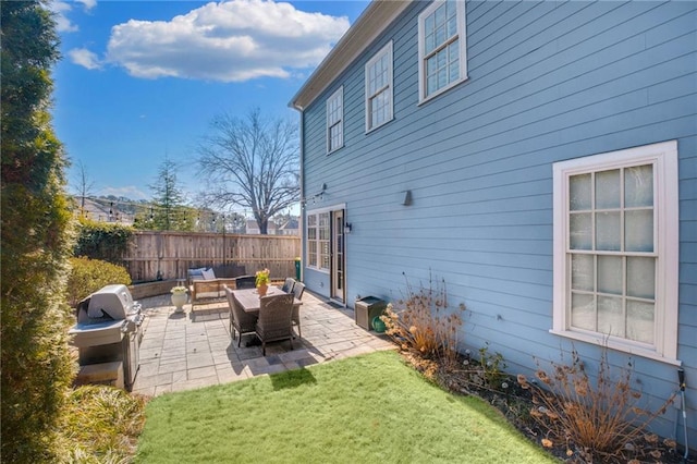 rear view of property featuring a patio, an outdoor hangout area, and a lawn