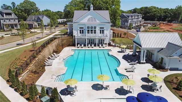 view of swimming pool featuring a patio area