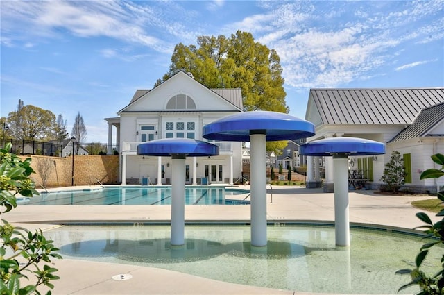 view of swimming pool with a patio area