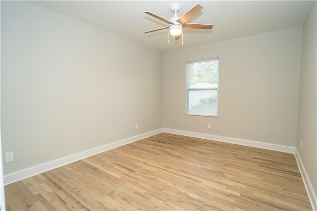 spare room featuring ceiling fan and light hardwood / wood-style floors