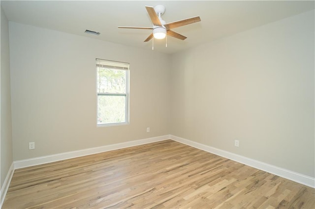 empty room featuring ceiling fan and light hardwood / wood-style floors