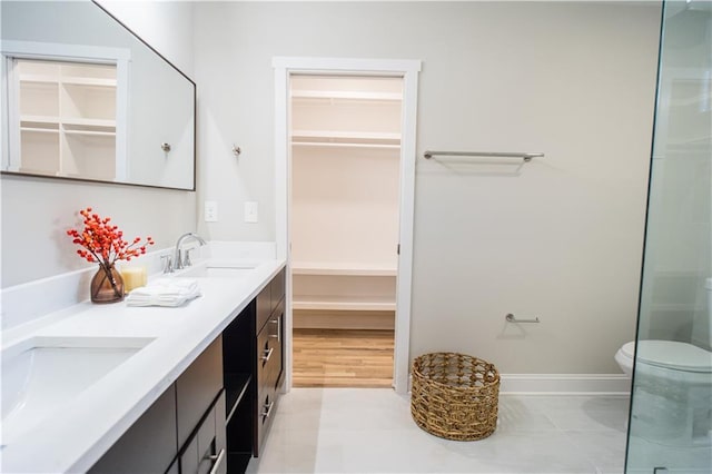 bathroom with vanity and toilet