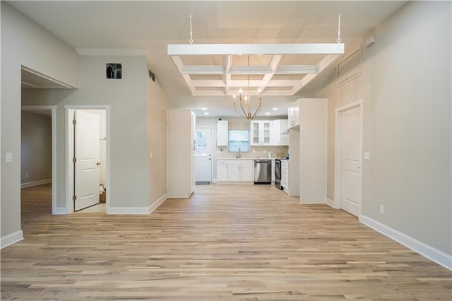 unfurnished living room with light hardwood / wood-style flooring, beamed ceiling, coffered ceiling, and an inviting chandelier