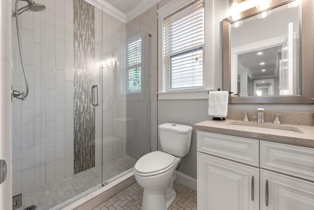 full bath with baseboards, a shower stall, ornamental molding, and toilet