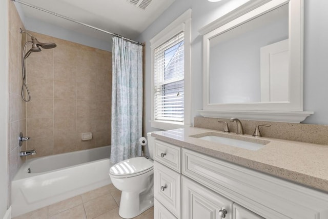 bathroom with tile patterned floors, visible vents, toilet, vanity, and shower / tub combo with curtain