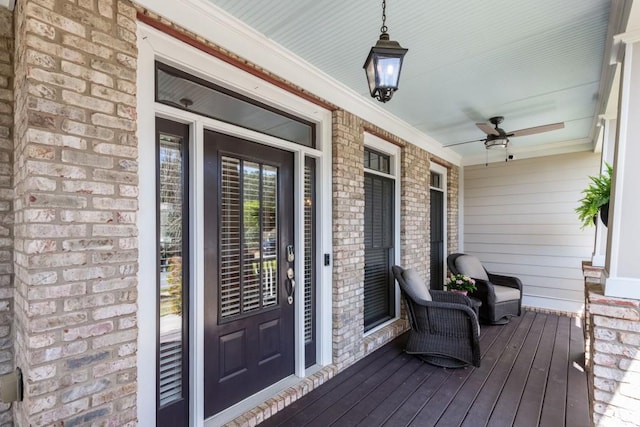 wooden deck with a ceiling fan and covered porch