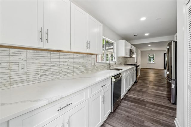 1978 Ethel Ln, Decatur, GA 30032 - kitchen featuring appliances with stainless steel finishes, dark wood-type flooring, white cabinetry, recessed lighting, and light stone counters