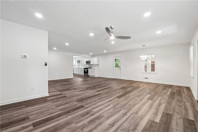 1978 Ethel Ln, Decatur, GA 30032 - unfurnished living room featuring a ceiling fan, recessed lighting, and wood finished floors