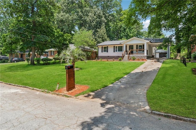 1978 Ethel Ln, Decatur, GA 30032 - view of front of house with concrete driveway, a front yard, crawl space, and covered porch