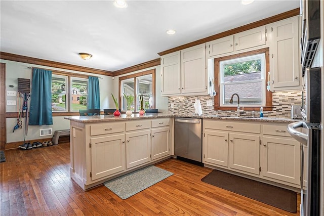 3392 Inns Brook Way, Snellville, GA 30039 - kitchen featuring dishwasher, a peninsula, a sink, plenty of natural light, and recessed lighting