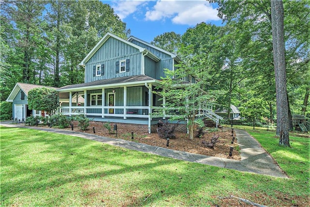 3392 Inns Brook Way, Snellville, GA 30039 - view of front of house with board and batten siding, covered porch, and a front yard