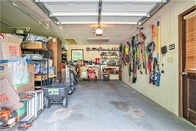 3392 Inns Brook Way, Snellville, GA 30039 - garage with a garage door opener and a workshop area