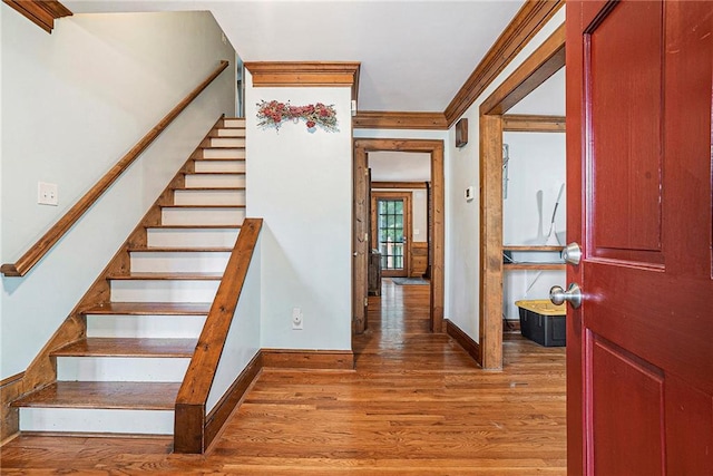 3392 Inns Brook Way, Snellville, GA 30039 - stairs featuring baseboards, wood finished floors, and crown molding