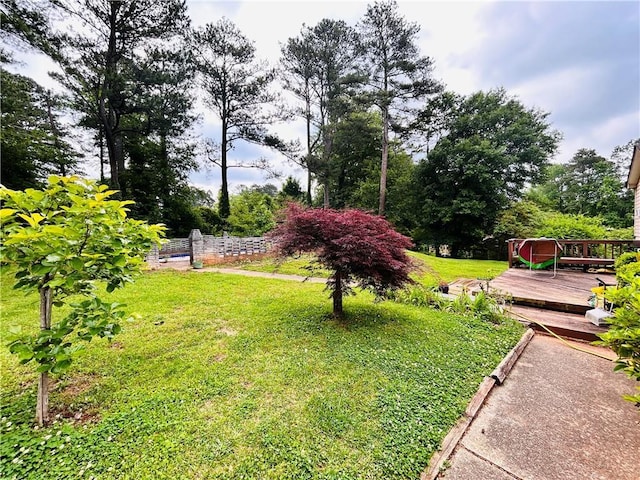 view of yard featuring a deck