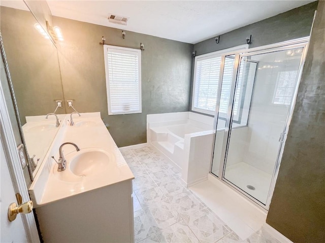 full bath featuring a sink, a stall shower, and a bath