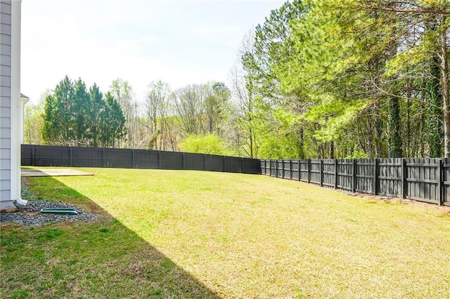 view of yard featuring a fenced backyard