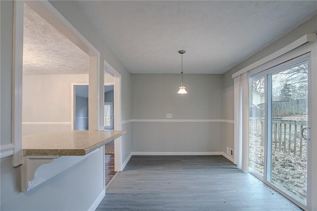 180 Sears Cir, Covington, GA 30016 - dining area with dark wood-type flooring and a textured ceiling