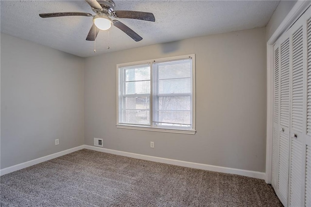 180 Sears Cir, Covington, GA 30016 - unfurnished bedroom featuring ceiling fan, carpet, a closet, and a textured ceiling