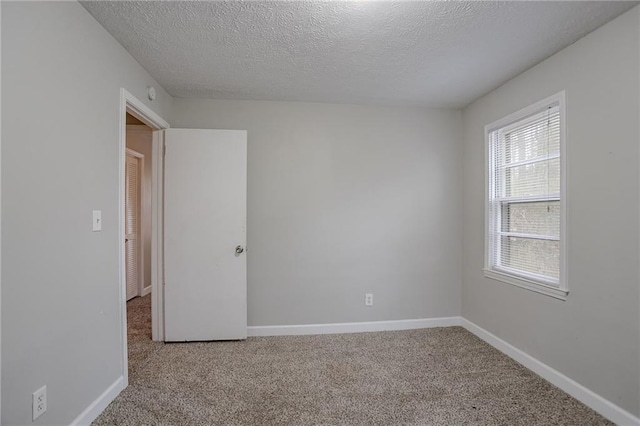 180 Sears Cir, Covington, GA 30016 - carpeted spare room with a textured ceiling