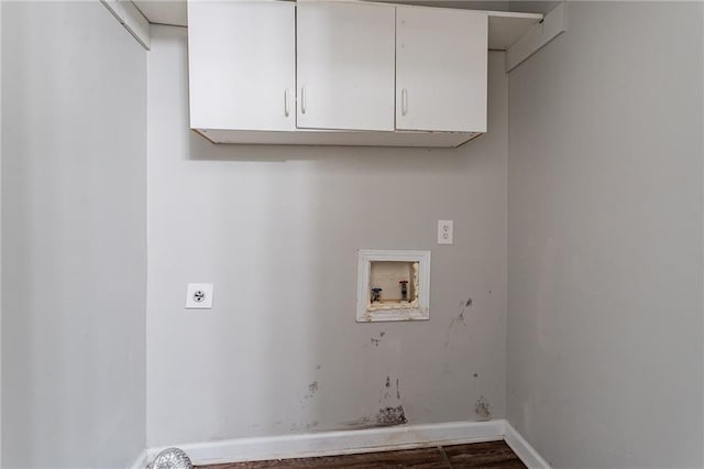 180 Sears Cir, Covington, GA 30016 - washroom featuring cabinets, electric dryer hookup, dark hardwood / wood-style floors, and washer hookup
