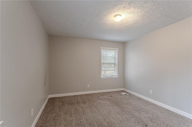 180 Sears Cir, Covington, GA 30016 - carpeted spare room featuring a textured ceiling