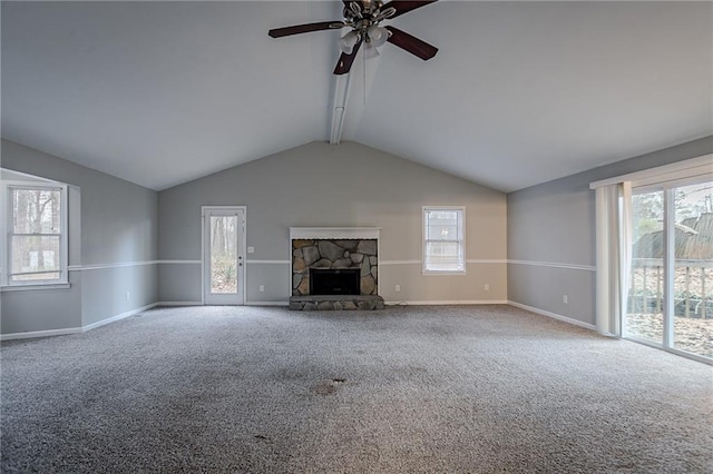180 Sears Cir, Covington, GA 30016 - unfurnished living room with vaulted ceiling, carpet, a wealth of natural light, and a fireplace