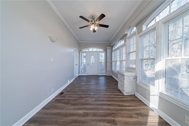 interior space with ceiling fan, crown molding, and dark hardwood / wood-style floors