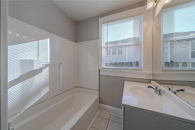 bathroom featuring shower / washtub combination, tile patterned flooring, and vanity