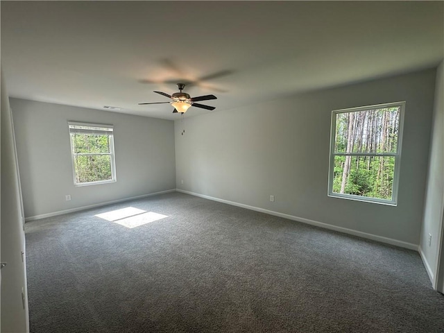 50 Emerald Ln, Covington, GA 30014 - carpeted empty room with baseboards and a ceiling fan