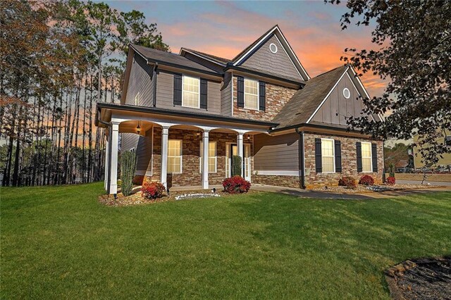 view of front facade with a garage and a front lawn